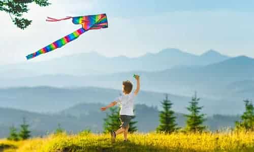 child-running-with-kite